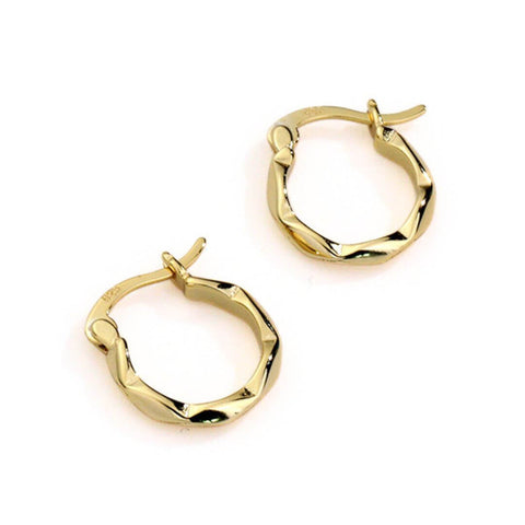 best selling gold hoop earrings for everyday wear. They have a unique texture design and a hinge clasp.