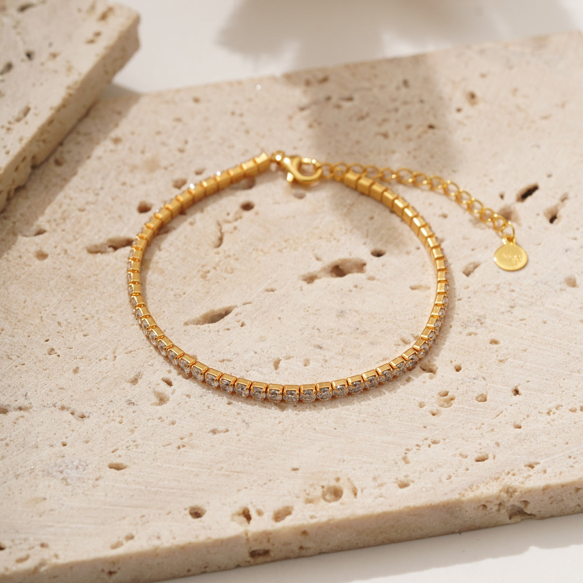 Crafted with meticulous precision, the Billie Tennis Bracelet showcases a seamless row of meticulously set gemstones that radiate brilliance and sparkle. Each stone, like a perfectly struck tennis ball, captures the essence of Billie Jean King's unwavering focus and unwavering determination on the court.