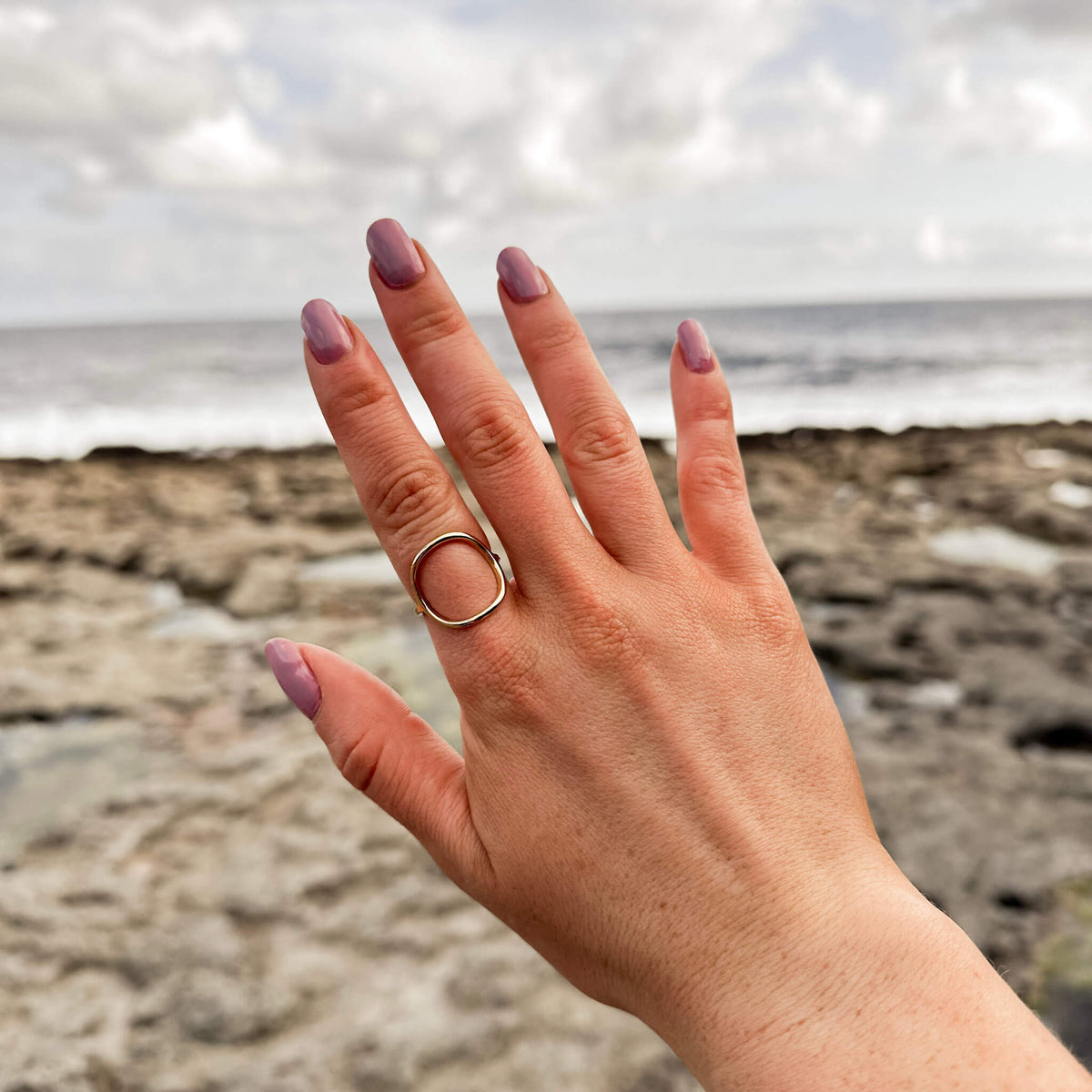circle shaped ring called the cosmic ring. it's a water resistant ring that can be styled up or down. Photographed in the aran islands. 