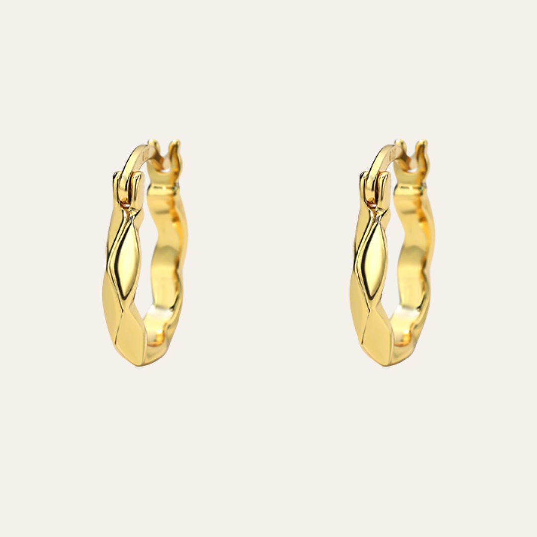 best selling gold hoop earrings for everyday wear. They have a unique texture design and a hinge clasp.