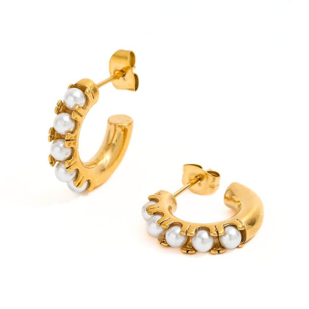 this is a photo of the timeless elena pearl hoop earrings. the earrings are the perfect everyday size. 