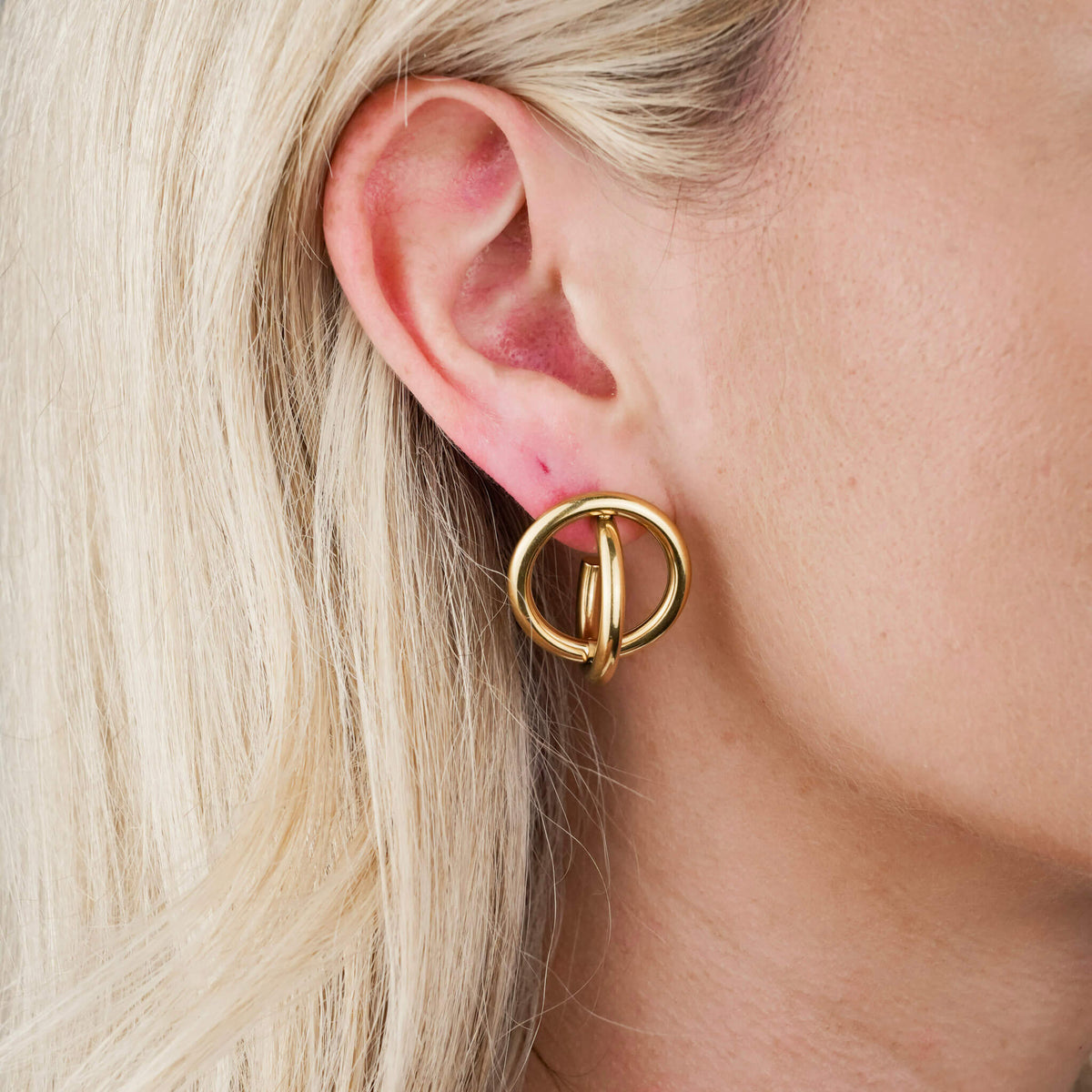 large statement hoop earrings from small irish business, Mettle & Bloom. The earrings feature two hoop which orbit around one another. 