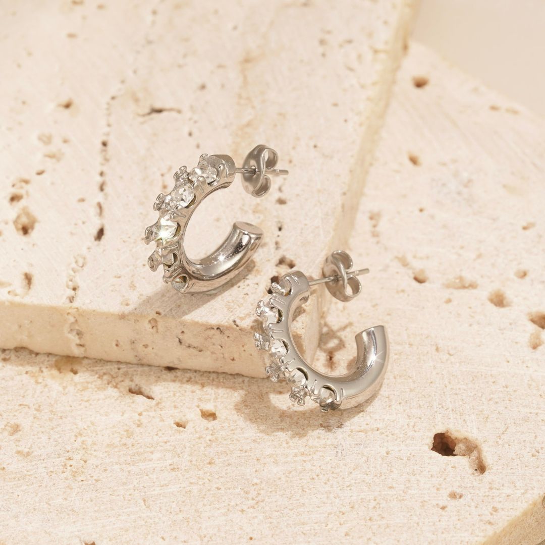 silver earrings with clear zirconia stones. the perfect size earrings for everyday wear.