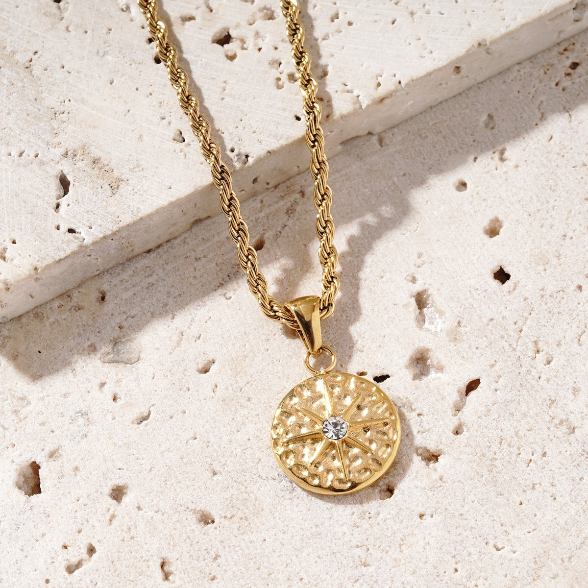 Designed by Mettle and Bloom to mirror the points of a compass, the Intuition Necklace is a quiet reminder that while maps can guide you, true direction often comes from within. Staying true to Mettle and Bloom's signature style, it is set on a softly hammered round pendant. The raised star motif draws the eye with its refined shape and the radiant centre stone captures the gaze.