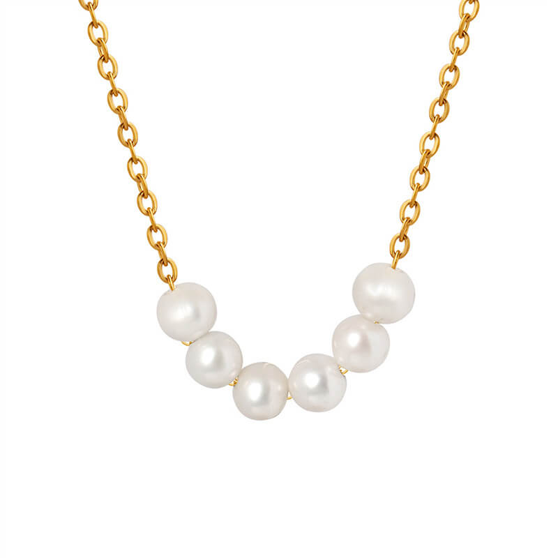 this is the oceanic pearl necklace. the necklace is elegant and timeless. it has a dainty gold chain which holds 6 fresh water pearls. the pearls can move freely along the chain. 