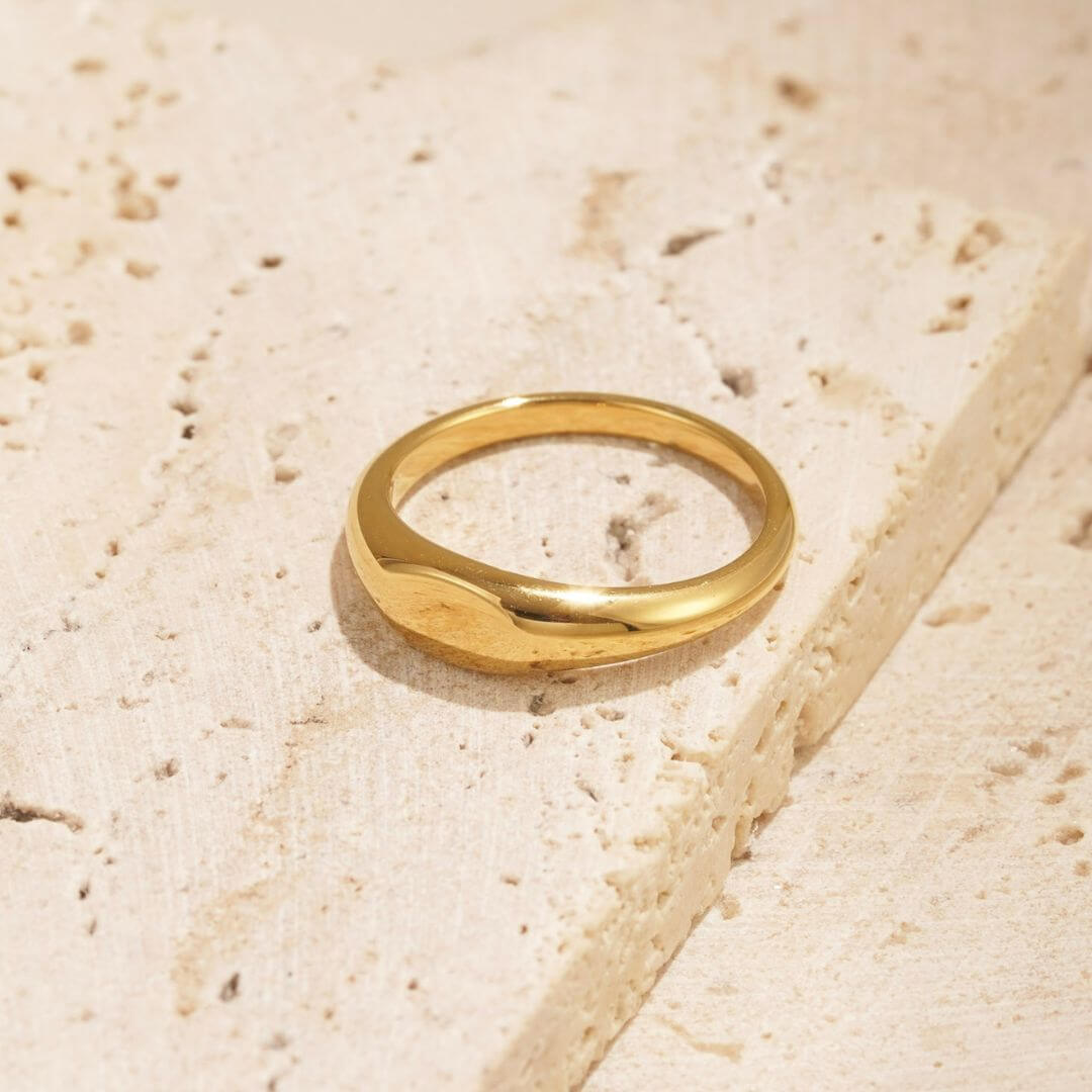 simple gold signet ring called the relic ring. perfect for engraving.
