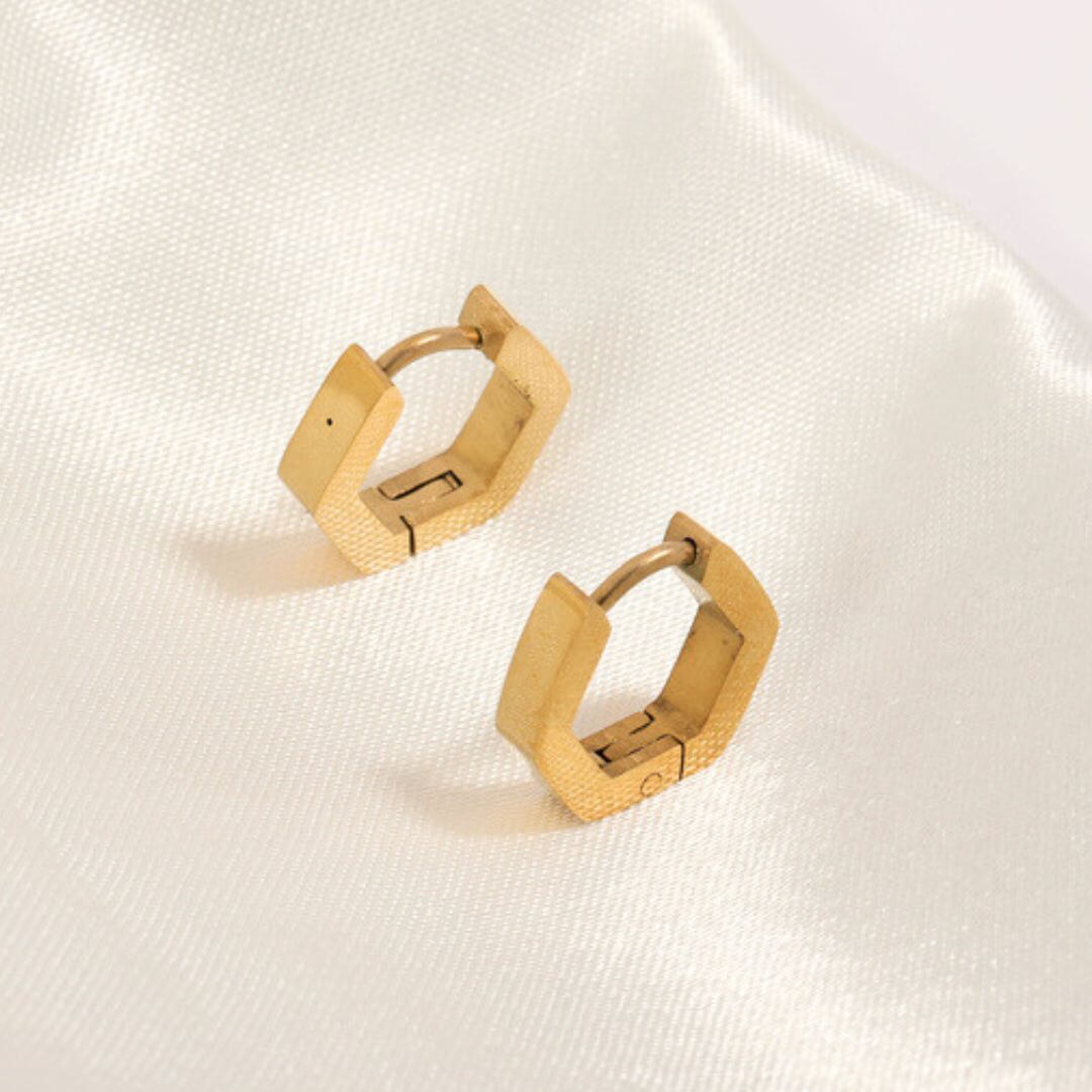 angular huggie hoop earrings that are comfortable to wear. The retro huggie hoops, also called sleepers, hug the earlobe closely. They are beautifully styled with the urbane hoop earrings. 
