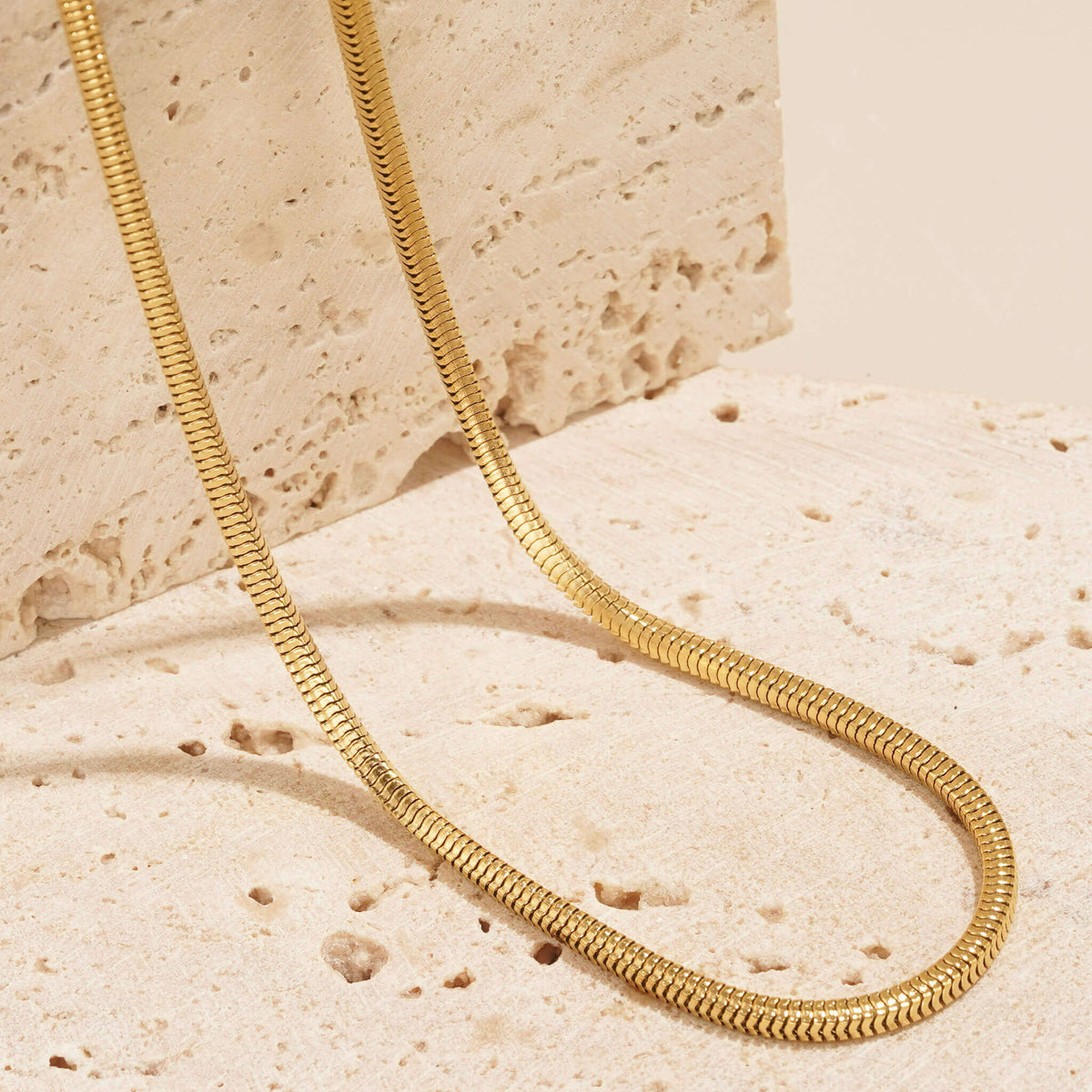 textured herringbone snake chain in gold plating available to shop at Mettle & Bloom