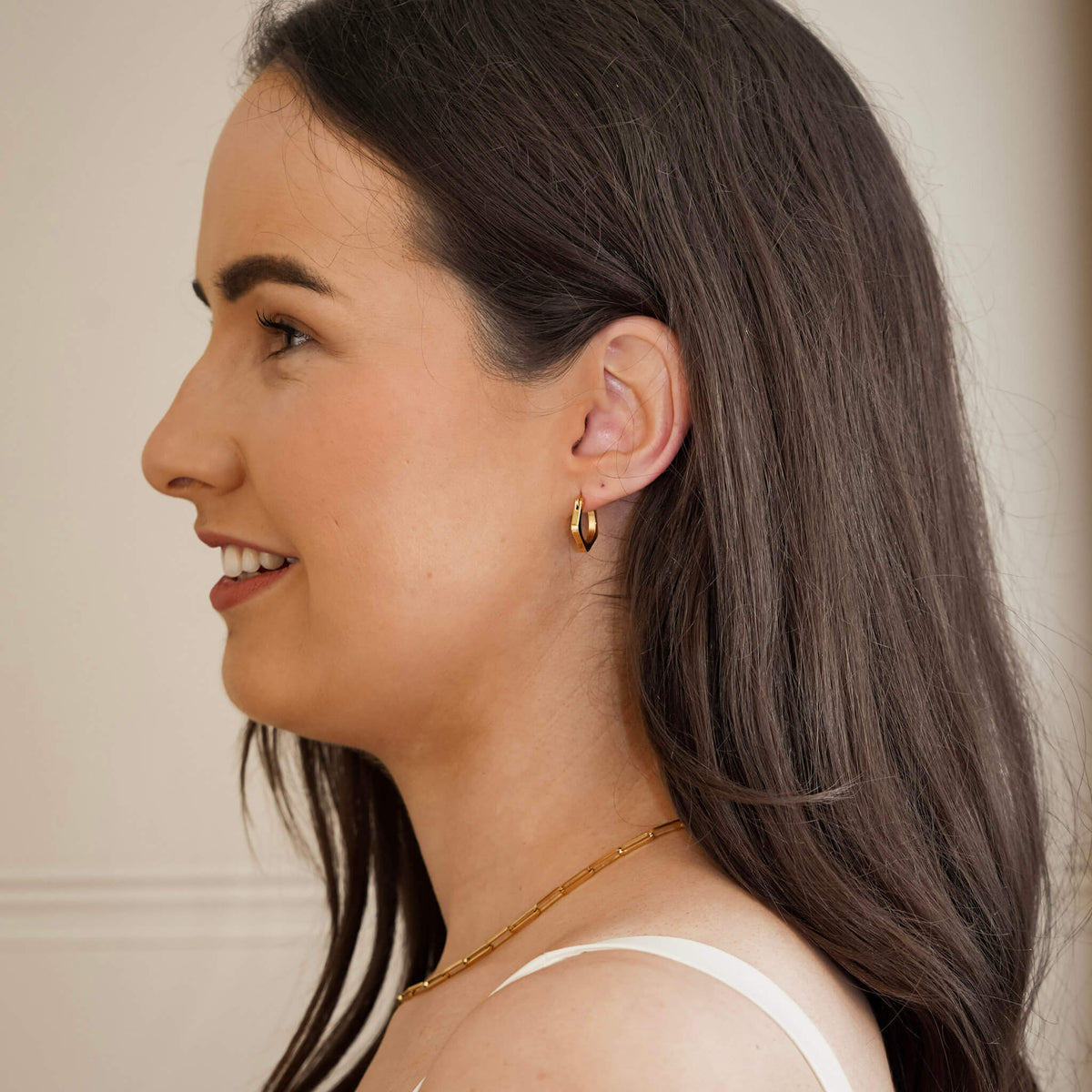 best selling earrings from Mettle & Bloom. These urbane hoop earrings have an angled design that is both contemporary and timeless. They have a hinge clasp and they are lightweight. 